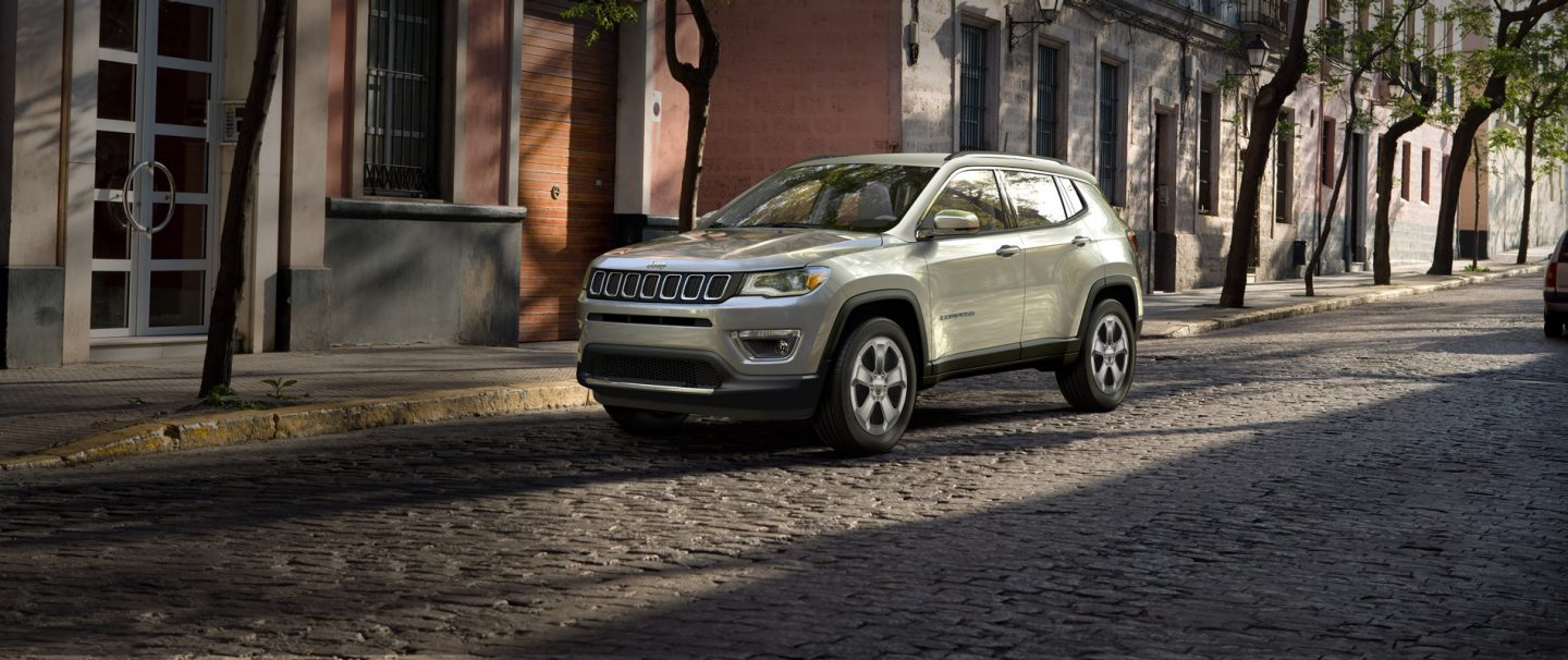 The 2021 Jeep Compass parked on an overpass.